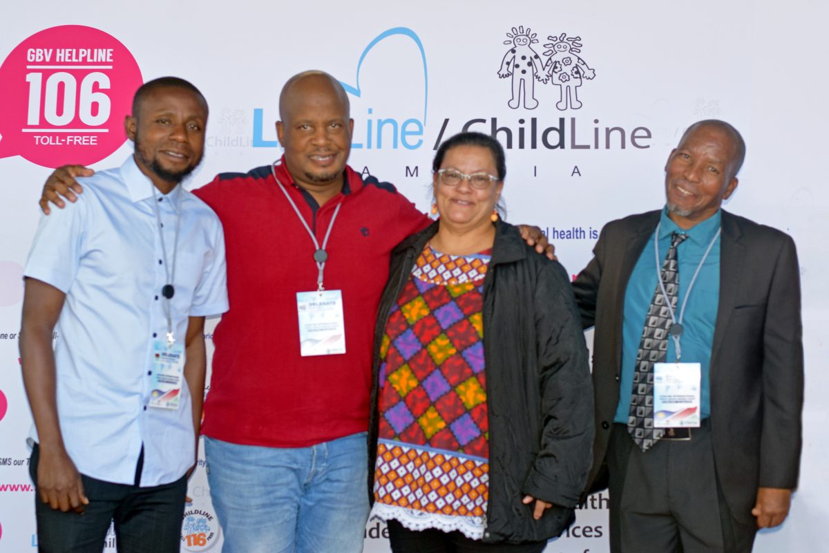 Nicolette Bessinger and delegates from the African Countries Regional Forum, shoulder-to-shoulder, smiling at the camera